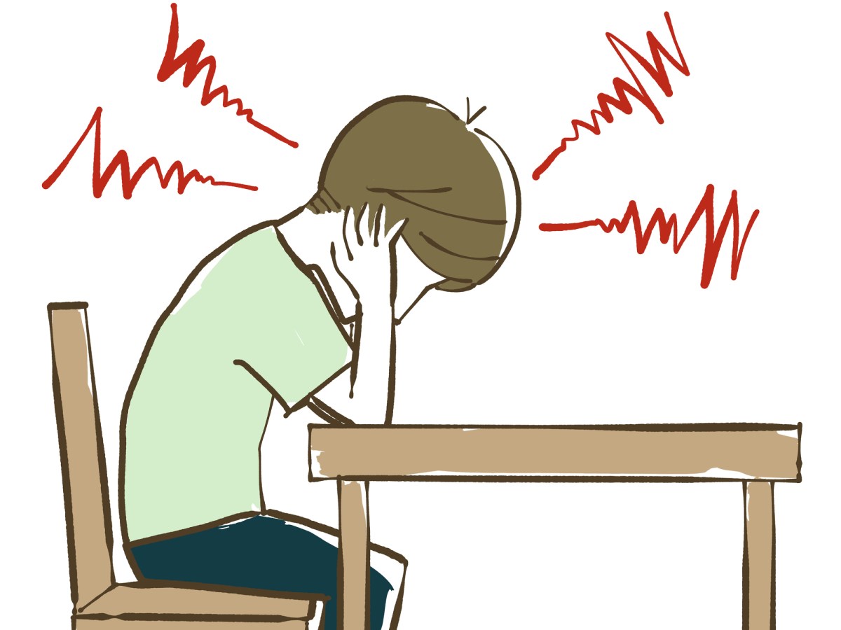 Man covering his ears