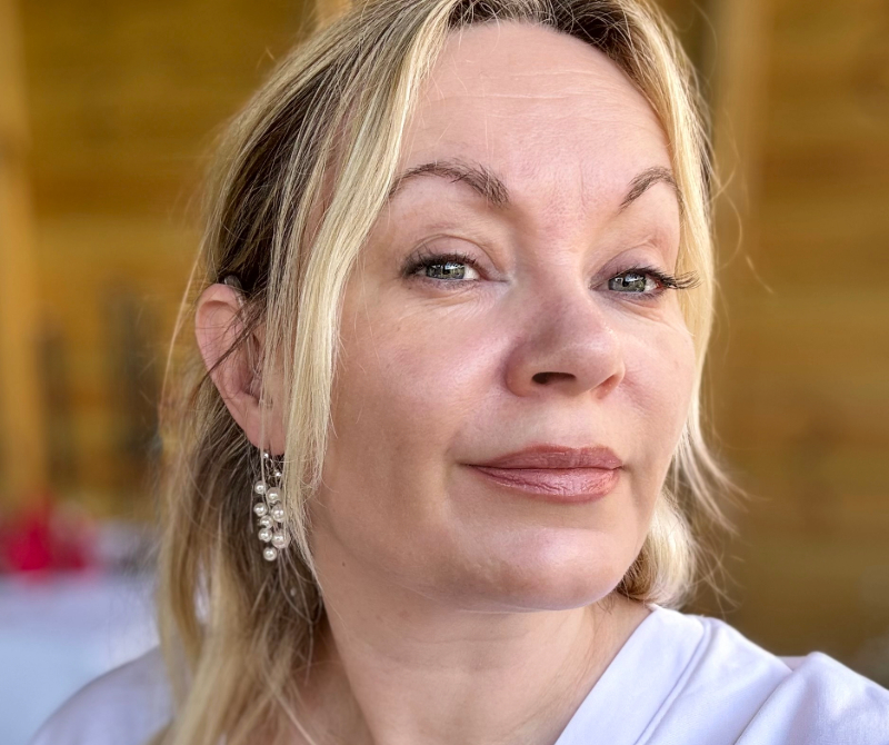 Author, Georgie St-Claire: a woman with blonde hair wearing a white shirt.